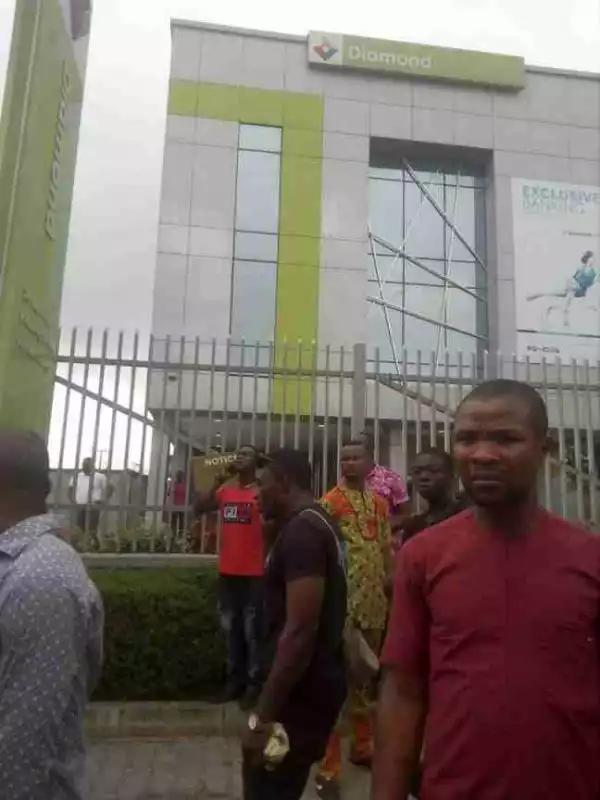 Armed Robber Set On Fire After Shooting Lady Dead Outside A Bank In Lagos (Graphic Photos)